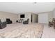 Spacious rec room with large TV and seating at 33161 Kateland Dr, Wesley Chapel, FL 33545