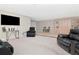 Large rec room with comfortable seating and a large TV at 33161 Kateland Dr, Wesley Chapel, FL 33545