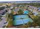 Aerial view of tennis courts and community pool at 33161 Kateland Dr, Wesley Chapel, FL 33545