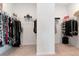 Large walk-in closet with ample hanging and shelving space at 33161 Kateland Dr, Wesley Chapel, FL 33545