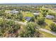 Lovely single Gathering home in a verdant community with sidewalks, grassy lawns, and scattered trees at 16760 Acapulco Rd, Punta Gorda, FL 33955
