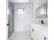 Modern bathroom with a large glass shower and double vanity at 16760 Acapulco Rd, Punta Gorda, FL 33955
