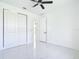 Bedroom features a ceiling fan, closet, and bright neutral paint at 16760 Acapulco Rd, Punta Gorda, FL 33955