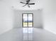 Large bedroom featuring modern ceiling fan, and black framed sliding glass doors at 16760 Acapulco Rd, Punta Gorda, FL 33955