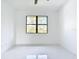 Bright bedroom with high ceilings, fan, light fixtures and marble flooring at 16760 Acapulco Rd, Punta Gorda, FL 33955