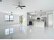 Bright open floor plan living area with kitchen in background at 16760 Acapulco Rd, Punta Gorda, FL 33955