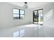 Bright living room with large windows and glass sliding doors at 16760 Acapulco Rd, Punta Gorda, FL 33955
