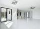 Bright and airy living room with modern lighting and tile floors at 16760 Acapulco Rd, Punta Gorda, FL 33955