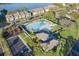 Community pool and playground with surrounding buildings in an aerial view at 275 114Th N Ave # 2, St Petersburg, FL 33716