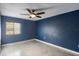 Spacious bedroom with ceiling fan and tile flooring at 275 114Th N Ave # 2, St Petersburg, FL 33716