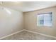 Empty bedroom with a window and tile flooring at 275 114Th N Ave # 2, St Petersburg, FL 33716