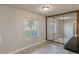 Dining area with tile floor, mirrored wall, and window at 275 114Th N Ave # 2, St Petersburg, FL 33716