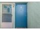 Building entryway with teal doors and screen door at 275 114Th N Ave # 2, St Petersburg, FL 33716