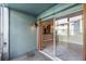 Private patio with sliding glass doors to the interior at 275 114Th N Ave # 2, St Petersburg, FL 33716