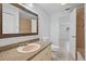 Simple bathroom with a vanity and view into another room at 4135 Bell Ave, Sarasota, FL 34231