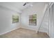 Charming bedroom with sloped ceilings, a window, and closet at 4135 Bell Ave, Sarasota, FL 34231