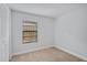 Cozy bedroom with a window and built-in closet at 4135 Bell Ave, Sarasota, FL 34231