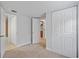Bedroom with ample closet space and view of another room at 4135 Bell Ave, Sarasota, FL 34231