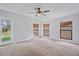 Spacious bedroom featuring three windows and a ceiling fan at 4135 Bell Ave, Sarasota, FL 34231