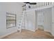 Unique bedroom with loft access and a built-in ladder at 4135 Bell Ave, Sarasota, FL 34231
