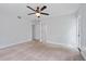 Bright bedroom with ceiling fan and access to a private patio at 4135 Bell Ave, Sarasota, FL 34231