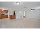 Open kitchen with island, wood cabinets and stainless steel appliances at 4135 Bell Ave, Sarasota, FL 34231