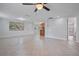 Bright and spacious living area with tile floors and access to kitchen at 4135 Bell Ave, Sarasota, FL 34231