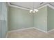 Spacious dining room with tile floors and chandelier at 2454 Yalta Ter, North Port, FL 34286