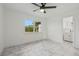 Bedroom with large window, tile floors, and ensuite bathroom at 8144 Trionfo Ave, North Port, FL 34287