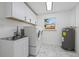 Laundry room with washer, dryer, and utility sink at 8144 Trionfo Ave, North Port, FL 34287