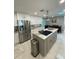 Modern kitchen with stainless steel appliances and island at 302 Strasburg Dr, Port Charlotte, FL 33954