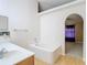 Bathroom with a bathtub and view to bedroom at 7319 Lagoon Rd, Spring Hill, FL 34606