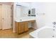 Bathroom with a vanity, bathtub, and mirror at 7319 Lagoon Rd, Spring Hill, FL 34606