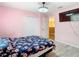 Bedroom with floral bedding and a ceiling fan at 7319 Lagoon Rd, Spring Hill, FL 34606