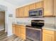 Modern kitchen featuring granite countertops and stainless steel appliances at 7319 Lagoon Rd, Spring Hill, FL 34606