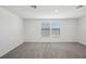 Empty carpeted room with natural lighting at 31637 Malbec Dr, Brooksville, FL 34602