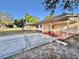 House exterior with covered patio and brick accents at 6108 Whiteway Dr, Temple Terrace, FL 33617