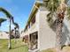 Condo with side yard and partial view of neighboring buildings at 2364 Hanover Dr, Dunedin, FL 34698
