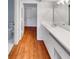 Bathroom with vanity, toilet and access to closet at 2364 Hanover Dr, Dunedin, FL 34698