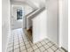 Clean entryway with tile flooring and staircase at 2364 Hanover Dr, Dunedin, FL 34698