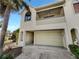 Two-story condo with attached garage and balcony at 2364 Hanover Dr, Dunedin, FL 34698