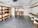 Spacious garage with ample storage shelving and workbench at 2364 Hanover Dr, Dunedin, FL 34698
