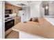 Kitchen with light wood cabinets and neutral countertops at 2364 Hanover Dr, Dunedin, FL 34698
