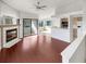 Open living area with hardwood floors and kitchen access at 2364 Hanover Dr, Dunedin, FL 34698