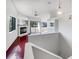 Open living room with hardwood floors and fireplace at 2364 Hanover Dr, Dunedin, FL 34698