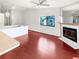 Living room with hardwood floors and fireplace at 2364 Hanover Dr, Dunedin, FL 34698