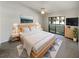Spacious main bedroom with wood platform bed and balcony access at 2364 Hanover Dr, Dunedin, FL 34698