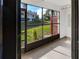 Screened porch with view of community at 2364 Hanover Dr, Dunedin, FL 34698