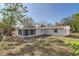 House with screened porch and large backyard at 4404 Terry Loop, New Port Richey, FL 34652
