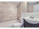 Clean bathroom with tile shower and dark vanity at 4404 Terry Loop, New Port Richey, FL 34652
